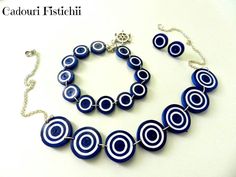 a necklace and bracelet made out of blue glass beads