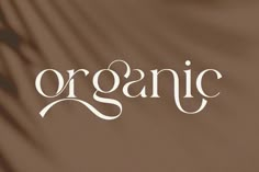 the word organic is written in white on a brown background with palm fronds