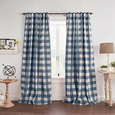 a living room with blue and white checkered curtains