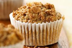 two muffins sitting on top of a wooden table