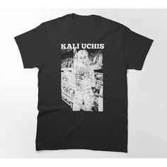 a black t - shirt with the words kalu uchis on it and an image of