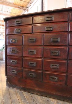 an old wooden dresser with many drawers