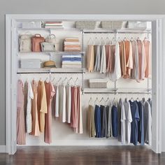 an organized closet with clothes and shoes