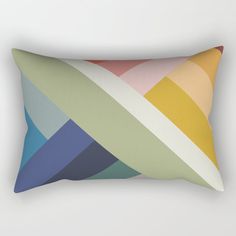 a rectangular pillow with multicolored lines on it