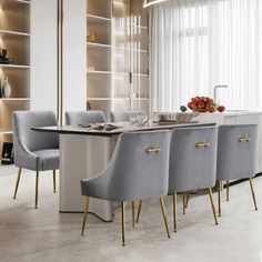 a dining room table and chairs in front of a book shelf with books on it