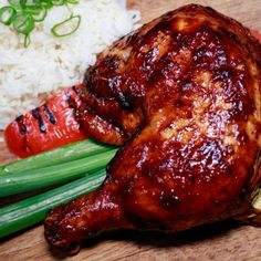 a close up of meat and vegetables on a cutting board