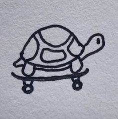 a drawing of a turtle is shown on the wall next to a toilet paper roll