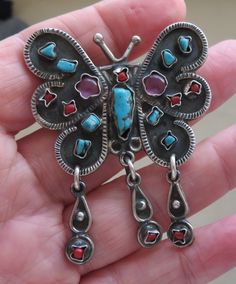 Beautiful butterfly brooch/pendant Stamped 925 Mexico. Set with natural gemstones Turquoise/Coral/Amethyst Lovely design with articulated drops. Good fastener. Measures approximately 2 inches by 2 inches. Good patina - please see photos. Will arrive in a box other than the one shown. Fast dispatch worldwide. I combine postage for multiple purchases. Free postage in the UK. Reduced postage worldwide. Returns accepted if not satisfied - buyer pays return postage. Feel free to ask questions about i Turquoise Butterfly Sterling Silver Jewelry, Silver Gemstone Brooch Collectible, Scarab Beetle Amethyst Jewelry, Sterling Silver Butterfly Gemstone Necklace, Elegant Collectible Butterfly Brooches, Silver Cuff Bangle, Sterling Silver Locket, Sterling Silver Brooch, Butterfly Brooch