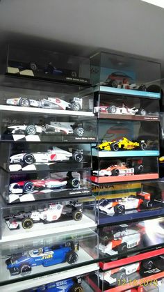 a display case filled with lots of toy cars