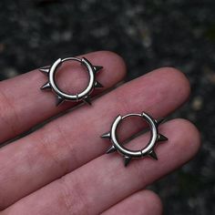 SILVER SPIKE HOOP EARRINGS * 100% Stainless Steel  Details:  * Size: 1.5 mm thickness x 12mm inner diameter. 16 mm outer diameter  * Stainless Steel. 💧 Waterproof. Questions? Message us! Here to help. Nickel-free Punk Earrings, Edgy Pierced Hoop Earrings As Gift, Edgy Hoop Earrings As A Gift, Edgy Small Hoop Pierced Earrings, Edgy Small Hoop Earrings As Gift, Punk Metal Earrings For Concerts, Trendy Metal Hoop Piercings, Punk Style Metal Earrings For Concert, Edgy Single Small Hoop Earring