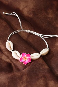 Experience the beauty of the ocean with our White Flower Seashell Adjustable Bracelet. Handcrafted with delicate white seashells, this bracelet adds a touch of elegance to any outfit. The adjustable design ensures a perfect fit for all. Bring a piece of the sea wherever you go. Flowers And Seashells, White Seashells, Push Up Lingerie, Ballroom Shoes, Polymer Clay Bracelet, Formal Wear Dresses, Clay Bracelet, Delicate Flowers, Beach Vibes