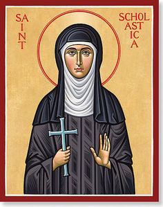 an icon of the mother mary with a cross in her hand and words above it