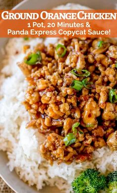 a white plate topped with rice and ground orange chicken