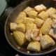 a pan filled with food on top of a stove