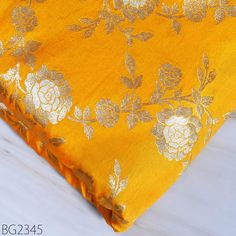 Indian Yellow Brocade by the Yard Banarasi Wedding Dresses Costumes Material Sewing Lehenga Skirts Vest Jacket Curtains Upholstery Crafting. This is a beautiful multi color banarasi brocade in floral design pattern ➤Product: Brocade Fabric ➤Fabric Type: Blended Silk (Viscose + Rayon and 30% Silk) Fine quality Zari Brocade Weaving from Banarasi. ➤Color: Yellow, Silver and Gold ➤Width: 44inches. ➤Condition: New ➤ Code: bg2345 ➤Listing for 1 Yard of fabric. ➤Care: Dry Clean Only You can use this fabric to make Dresses, Tops, Blouses, Jackets, Crafting, Clutches or Evening Bags, Embellish your clothes, Pillows, Drapery, Home Décor, Outdoor, Quilting, Sewing, General, Upholstery etc use it for scrap booking projects. If you purchase more than 1 Yard you will get it in running length, not in pie Gold Brocade Sharara For Eid, Brocade Unstitched Suit For Wedding Diwali, Brocade Unstitched Suit For Wedding And Diwali, Gold Brocade Choli For Eid, Yellow Unstitched Suit With Intricate Embroidery For Wedding, Brocade Unstitched Suit For Wedding With Traditional Drape, Brocade Unstitched Suit With Dupatta For Wedding, Wedding Brocade Unstitched Suit With Traditional Drape, Yellow Art Silk Unstitched Suit For Wedding