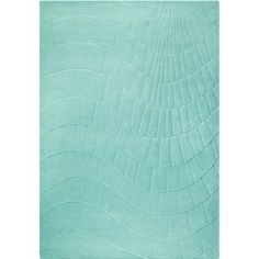 an aqua green rug with wavy lines on the bottom and sides, in front of a white