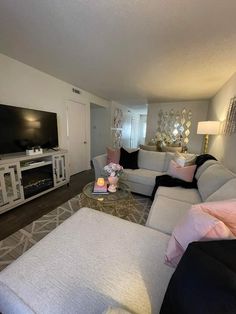 a living room filled with furniture and a flat screen tv