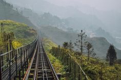 a train track running along the side of a mountain