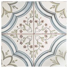 an artistic tile design with flowers and leaves