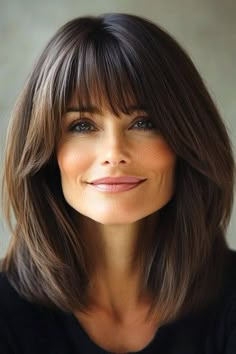 Save this pin for the best medium-length hairstyles with bangs. The blunt bangs add a bold element, while the lob sits past shoulders, offering a clean, structured shape.  The length of the lob strikes a perfect balance - long enough to be styled in different ways (or pulled back into a ponytail) yet short enough to be easy to manage. Bob With Bangs For Thick Hair, Shoulder Length Lob With Bangs, Mid Length Haircut With Bangs, Hairstyles For Medium Length Hair With Bangs, Lob Haircut With Bangs, The Lob, Haircuts For Medium Length Hair, Layered Haircuts For Medium Hair, Long Healthy Hair