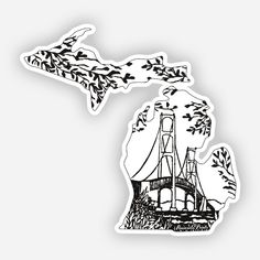 a black and white sticker with the outline of a bridge in the distance, surrounded by trees