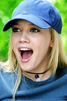 a close up of a person wearing a hat