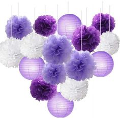 purple and white paper flowers hanging from strings