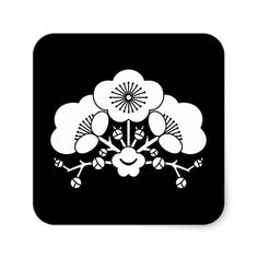 a black and white square with flowers on it