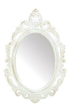 an ornate white mirror is hanging on the wall