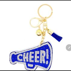 a keychain with the word cheer on it and a megaphone charm attached to it