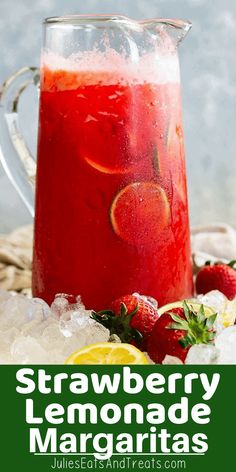 strawberry lemonade margarita in a pitcher with ice and strawberries