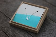 Circle Wave Necklace A gorgeous addition for any ocean loving chica! Sterling silver and hung on an adjustable 15.5 - 17.5 inch sterling silver curb chain. A great match for our wave studs! Dainty & delicate the wave measures 13mm x 13mm