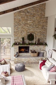 a living room filled with lots of furniture and a fire place in the middle of it