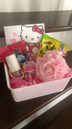 a hello kitty gift basket on a table