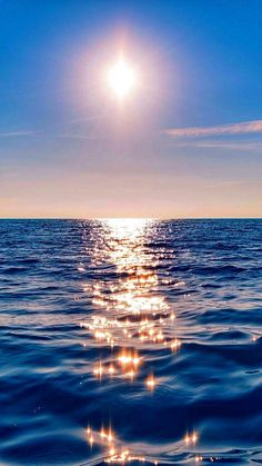 the sun shines brightly over the ocean as it reflects on the water's surface