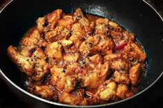 chicken curry in a pan on the stove