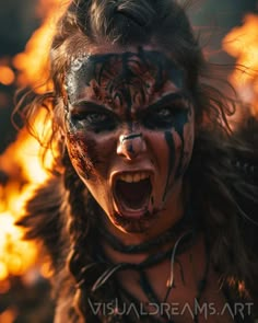 a woman with her face painted in black and white, is screaming at the camera