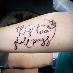 a person with a tattoo on their arm that says it's too hallpass