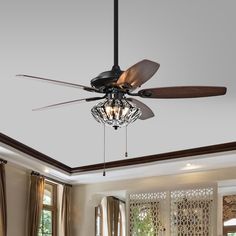 a ceiling fan that is hanging from the ceiling