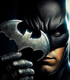 batman the dark knight rises movie poster with man's face and hands holding a bat