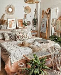 a bedroom with white walls and lots of plants