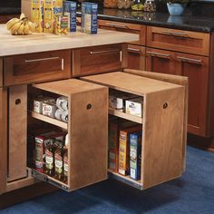 an open cabinet in the middle of a kitchen