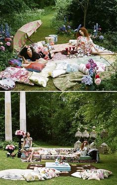 two women sitting on a blanket in the grass with an umbrella over their head and picnicking