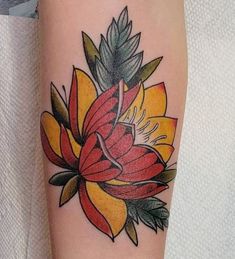 a tattoo with a flower on the arm