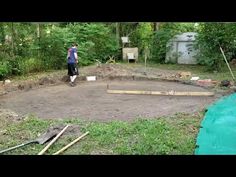 a man standing in the middle of a yard