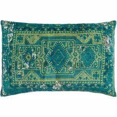 a green and blue decorative pillow on a white background