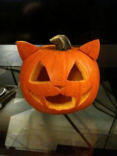 a pumpkin with a cat's head carved into it