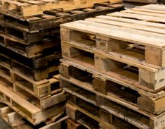 several wooden pallets stacked on top of each other