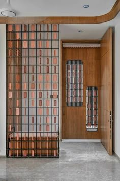 an entry way with a wooden door and metal screen