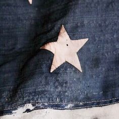 an old pair of jeans with a star painted on it